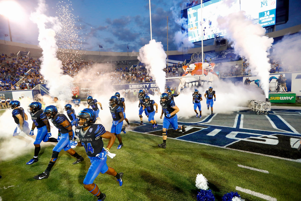 Memphis Tigers players take the field to play Navy at Liberty Bowl Memorial Stadium on Sept. 26, 2019. Courtesy Joe Rondone / The Commercial Appeal