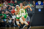 Oregon's Sabrina Ionescu dribbles and Minyon Moore trails during the first half as the No. 1 seed Oregon Ducks face the No. 3 seed Stanford Cardinal in the championship game of the Pac-12 women's basketball tournament on March 8, 2020, at Mandalay Bay Events Center in Las Vegas. Courtesy Serena Morones, The Oregonian/OregonLive