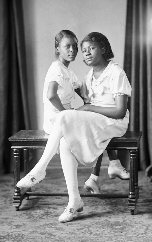 Portrait of two sisters photographed by William H. Zoeller in Elizabeth City, circa 1930. Zoeller operated a photography studio in the city from 1892 into the 1930s using glass-plate technology. Courtesy Museum of the Albemarle