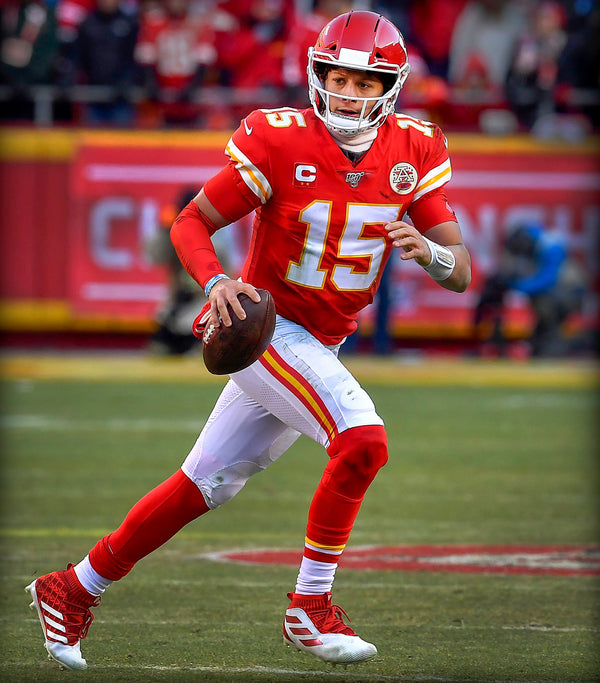 A locked-in-as-ever Mahomes rolls out of the pocket and looks for an open receiver during the AFC Championship Game on Jan. 19, 2020, at Arrowhead Stadium.  Kansas City Star / Rich Sugg