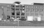Dwarfed by the expanded HUB in the background, PSU student Carolyn Kirby, 20, studies on the HUB lawn, May 11, 1999. Centre Daily Times Archives, Michele Rowland photo