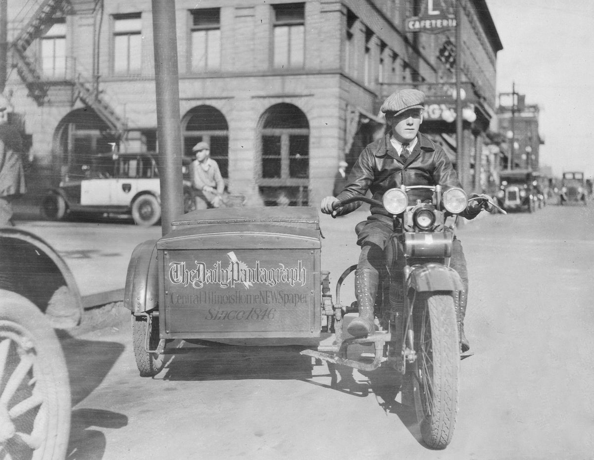 Pantagraph motorcyclist delivering newspapers, circa 1925. Courtesy of the McLean County Museum of History, Pantagraph Collection