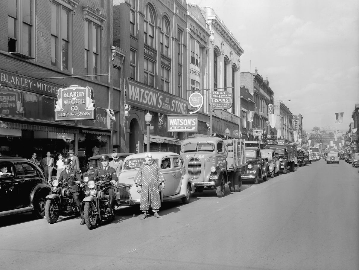 Bristol Police officers leading the way in the Ford Truck Parade on State Street in Bristol, TN-VA, May 11, 1939. The parade was sponsored by States Motors, the Ford dealer in Bristol. This is the 500 block of State Street on the Virginia side. Courtesy Bristol Historical Association