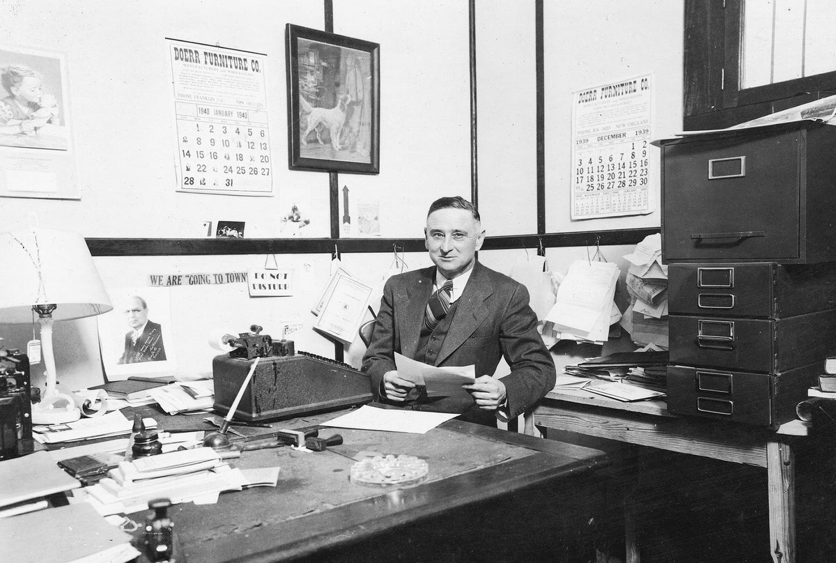 Walter W. Lewis, son of Frank H. Lewis, at Lewis Furniture Company and Lewis Pecan Company in downtown Pascagoula, 1939. Walter was also editor of The Chonicle Newspaper.