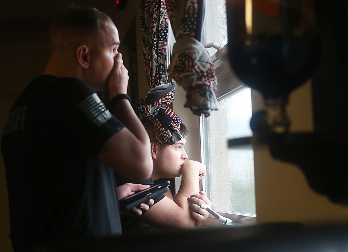 Bay County Sheriff's Office Dept. Alex Young and Dept. Jared Waker watch Hurricane Michael from the Thomas Drive fire station. Courtesy Patti Blake / The News Herald