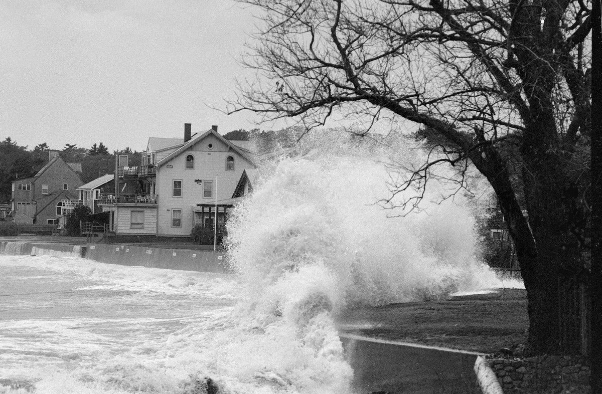A huge wave crashes over a wall behind Kettle Cove in Magnolia. Gloucester Daily Times