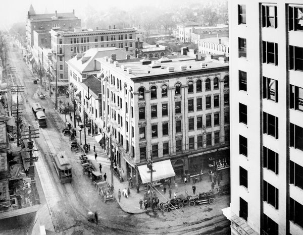 Intersection of Fayetteville and Martin Streets looking west from the Commercial National Bank, circa 1912. Citizen’s National Bank is visible in the foreground on the right. The construction/expansion project of Century Post Office is visible on the far left. Courtesy State Archives of North Carolina / #PhC68.1.119