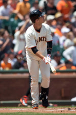 Buster Posey of the San Francisco Giants hits a grand slam home run off of Vidal Nuno of the Arizona Diamondbacks during the fifth inning at AT&T Park on July 13, 2014, in San Francisco. The San Francisco Giants defeated the Arizona Diamondbacks 8-4. Jason O. Watson / Getty Images