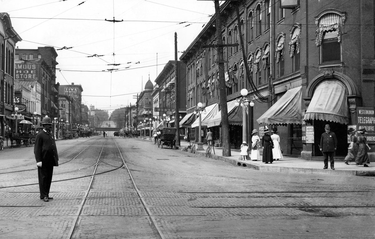 Davenport policemen at the intersection of West 3rd and Brady streets, looking north along Brady, Davenport, circa 1910s. Courtesy Quad-City Times
