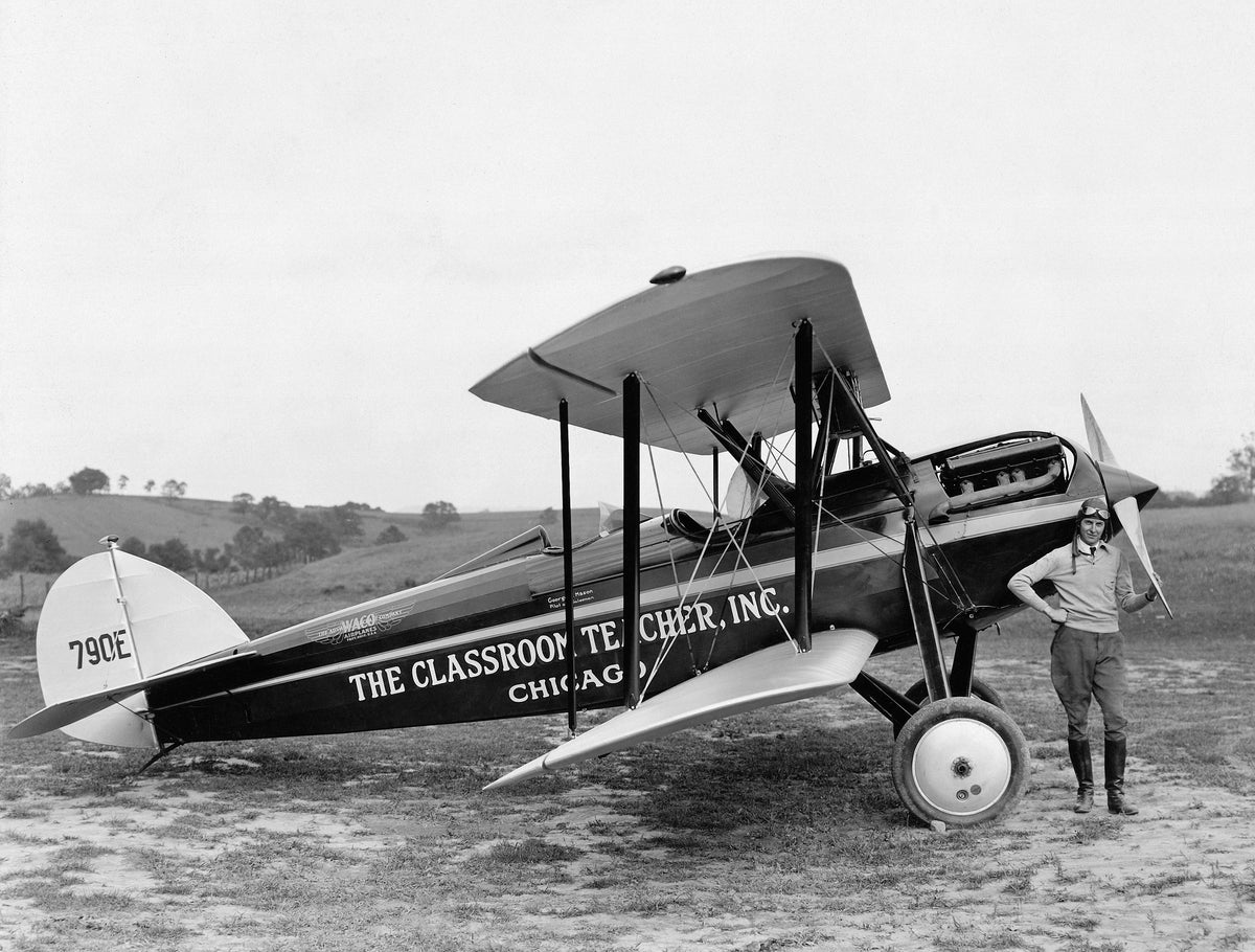 Early Roanoke aviator George H. Mason with his Waco, 1929. Mason sold textbooks throughout Virginia, the Carolinas, Georgia, and Florida. He would circle a town, drawing attention, and then land near schoolyards to take book orders, often addressing the awestruck students. COURTESY VIRGINIA ROOM, ROANOKE PUBLIC LIBRARIES