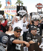 Raiders fans celebrate on March 27, 2017, at the Welcome to Las Vegas sign after NFL owners voted in Phoenix to approve the team’s relocation from Oakland to Las Vegas. Bizuayehu Tesfaye/Las Vegas Review-Journal