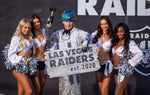 Construction painter Angel Ayala poses with a hammer between members of the Raiderettes during the official announcement ceremony for the Las Vegas Raiders at Allegiant Stadium on Jan. 22, 2020. L.E. Baskow/Las Vegas Review-Journal