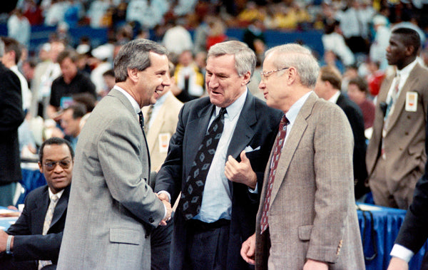 Coaches Roy Williams (left), then at Kansas, Dean Smith and assistant coach Bill Guthridge talk before the Tar Heels faced the Jayhawks at the 1993 Final Four in New Orleans. Courtesy Scott Sharpe / The News & Observer