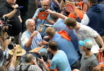 UNC head coach Roy Williams is surrounded by media and fans as he signs autographs after the Tar Heels hold their open practice, March 31, 2017, at the NCAA Final Four in Glendale, Ariz., in the University of Phoenix Stadium. The Heels will play Oregon Saturday in the semi-final game. Courtesy Chuck Liddy / The News & Observer