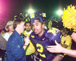 Charles Woodson leaves the podium after the trophy celebrates in post game action at the Rose Bowl on Jan. 1, 1998, in Pasadena. Kirthmon F. Dozier / Detroit Free Press