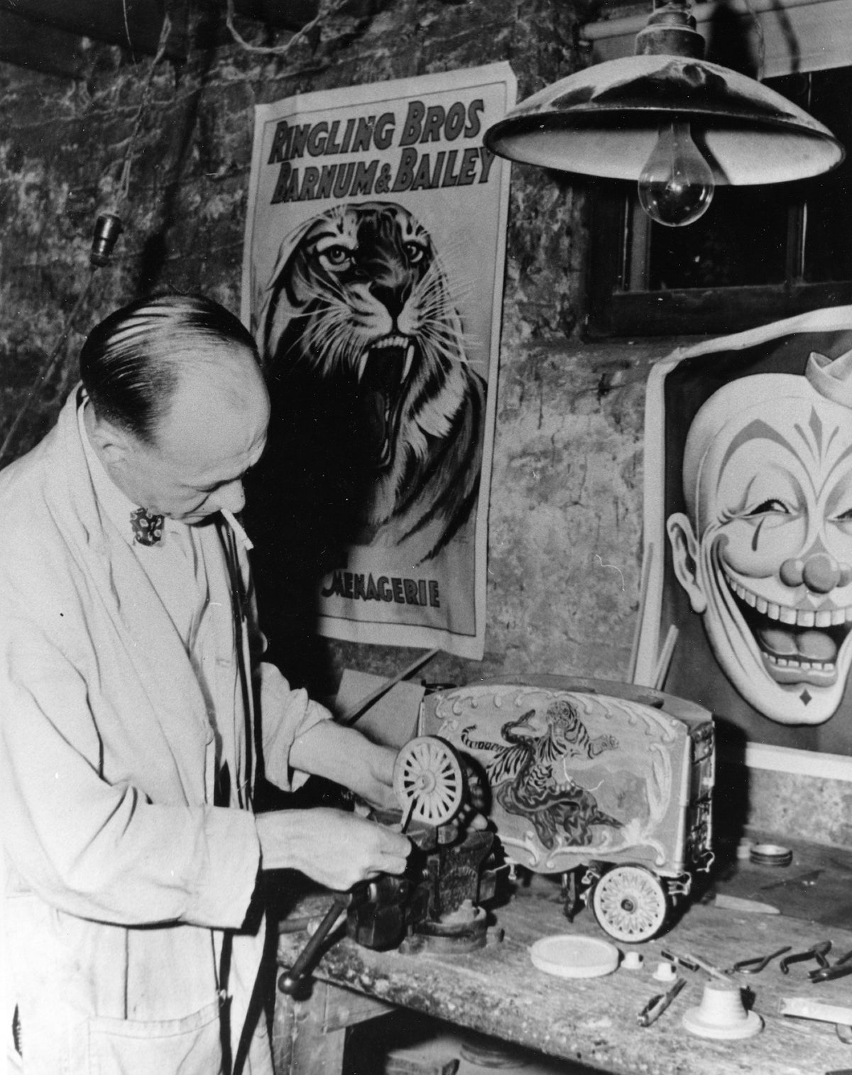 Joe W. Taggart who lived on National Avenue in Rockford was a professional circus model builder. He was known as the "Pioneer King of All Miniature Showmen." He made miniature circus wagons and sold them to many people. Many of his miniatures are now owned by museums throughout the country. He is seen here in 1949.