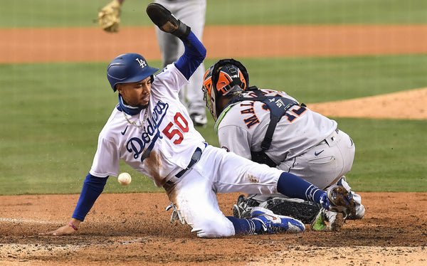 You can’t tag someone out if you don’t have the ball. That’s what happened here as Mookie Betts scores as the ball eludes Martin Maldonado of the Houston Astros. Wally Skalij / Los Angeles Times