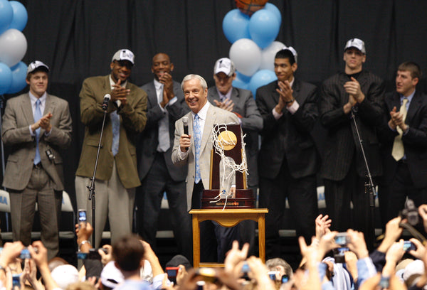 Coach Roy Williams smiles at the thunderous applause from Tar Heel fans as the team takes center stage at the Dean Smith Center the day after they won the 2009 NCAA men's basketball national championship. Courtesy Shawn Rocco / The News & Observer