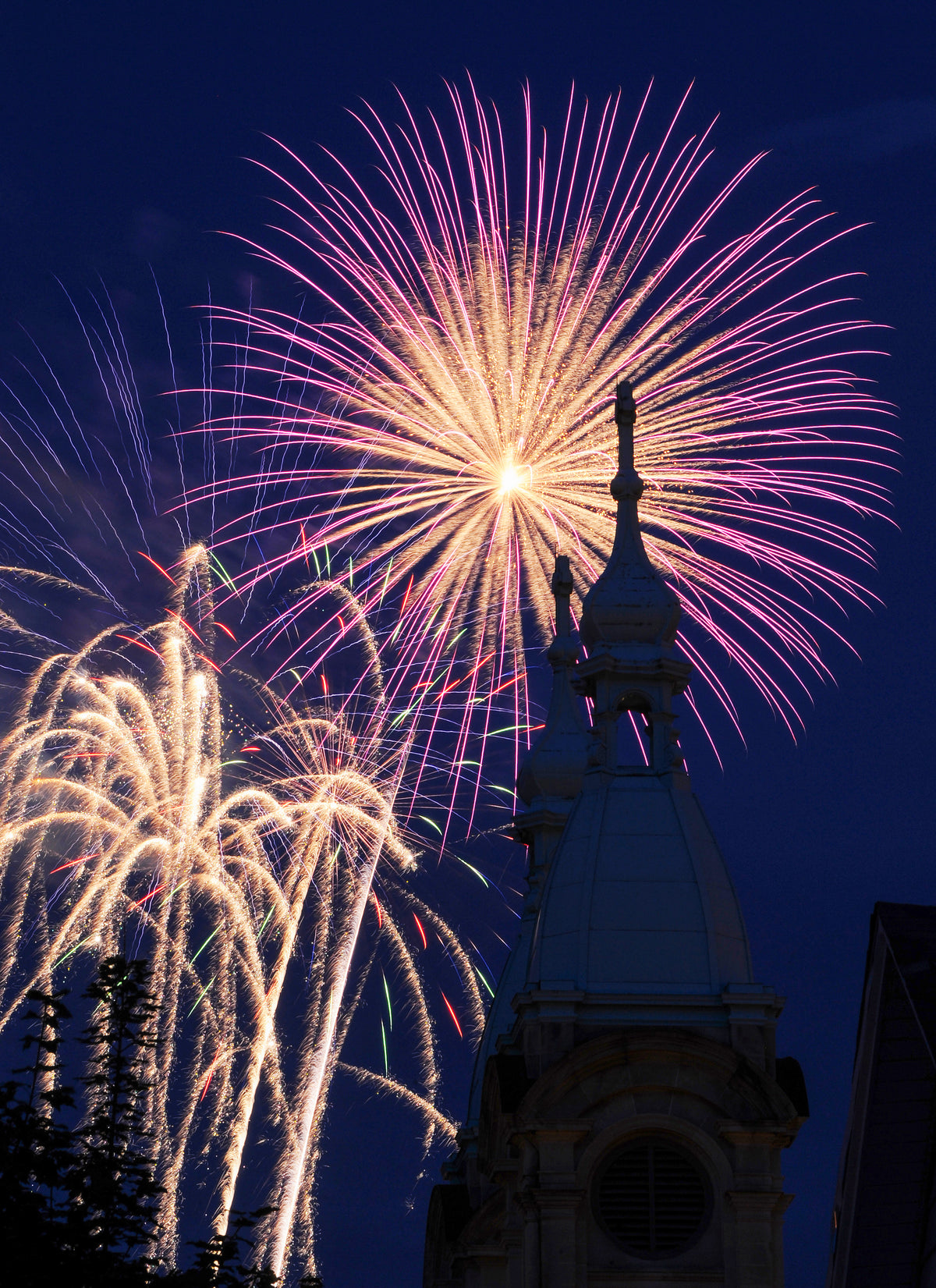 Fireworks exploding over the twin steeples of Resurrection Church in the Cambria City section of Johnstown during the city’s annual Independence Day celebration, July 4, 2018. Courtesy The Tribune-Democrat