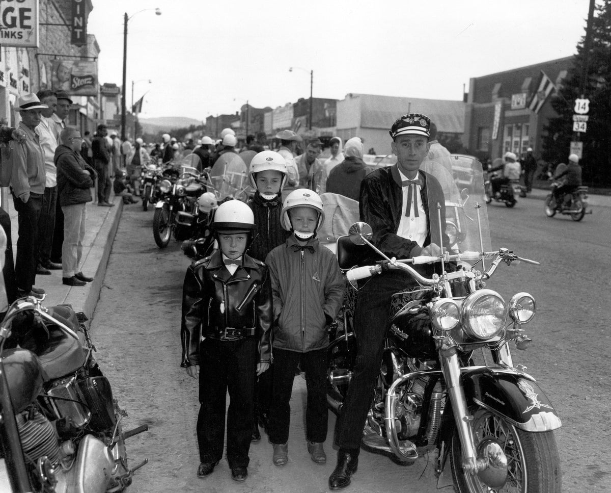 Don Larson, right, one of the founding members of the Jackpine Gypsies, gets ready for a ride in 1964. He is pictured with his two sons Chris and Darrel and family friend Rick Hultman.