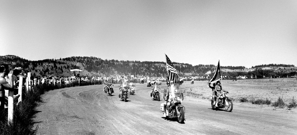 Members of the Motor Maids, a motorcycle club comprised of women, ride around the track before the start of a race in 1960s.