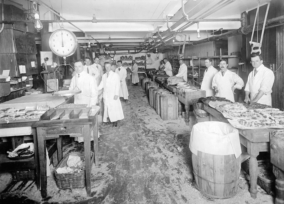 Providence Public Market, 1915. Anthony Vitale, also known as Tony Masters, is standing first from left. He was known for his meat-cutting skills and was the meat manager for between 35 and 40 men working in the cutting room. The temperature in the cutting room was kept between 32 and 35 degrees, and ice blocks were installed in the ceiling. Courtesy Family collection of Anthony P. Vitale