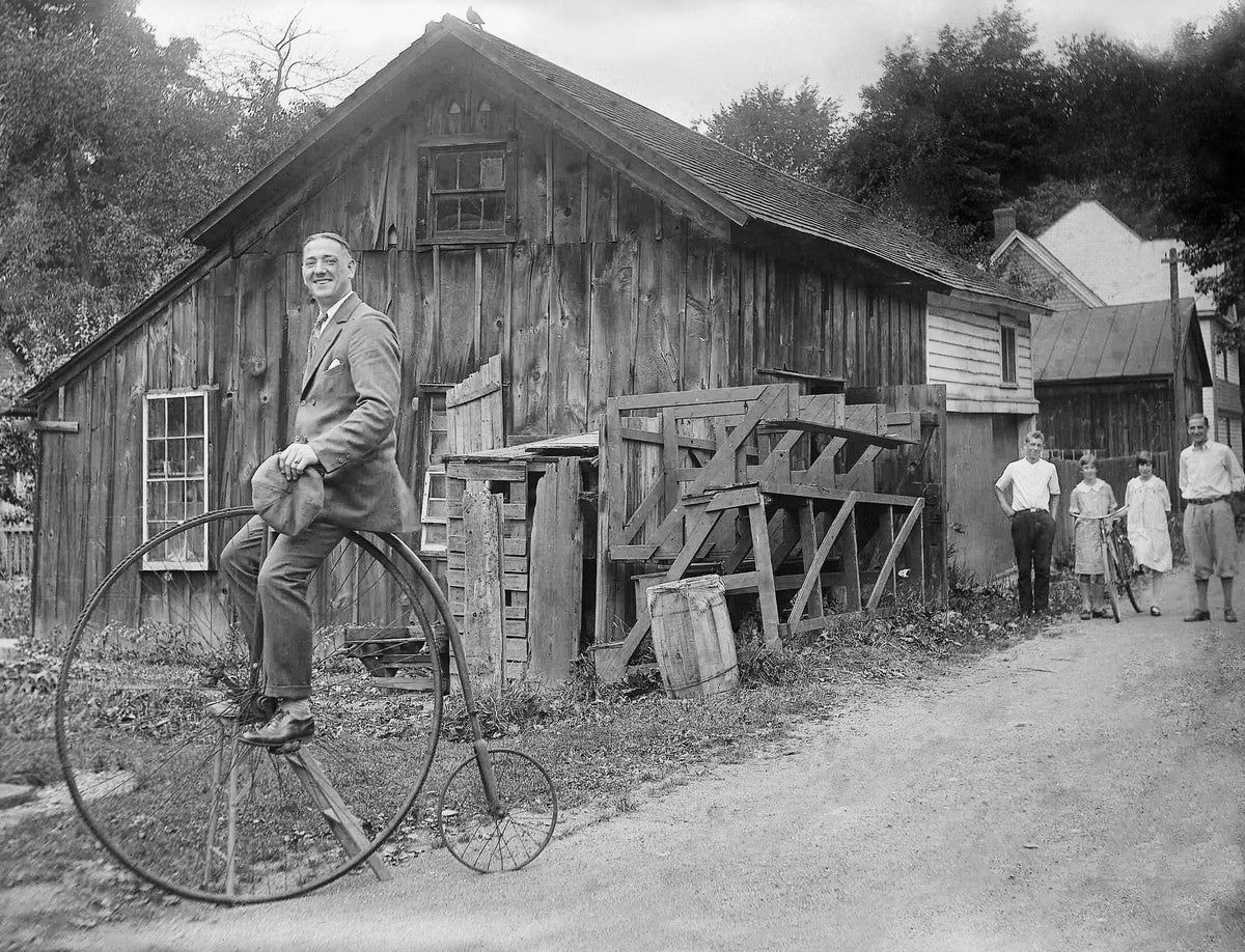 Man riding a penny-farthing, circa 1915. Courtesy Oneida County History Center