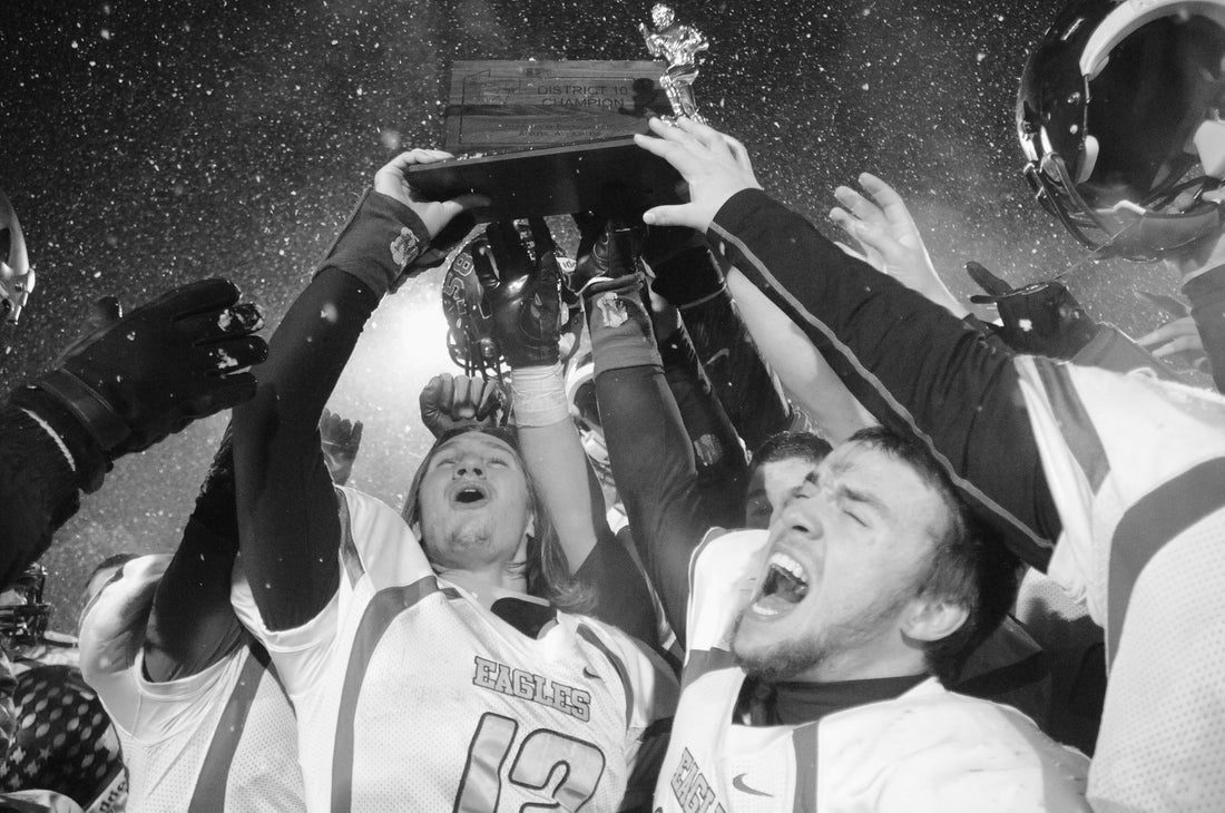 Conneaut Area Senior High football players celebrating their District 10 Class AAA championship in 2014, the school's third year of existence following the consolidation of Conneaut Lake, Conneaut Valley and Linesville High Schools. CASH beat Cathedral Prep 14-7 for the title. Courtesy Meadville Tribune