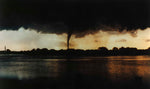 A tornado darkens the sunset sky above Sioux City in 1986. Sioux City Museum