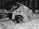 Soldiers work to clear debris after the storm. Public Library of New London