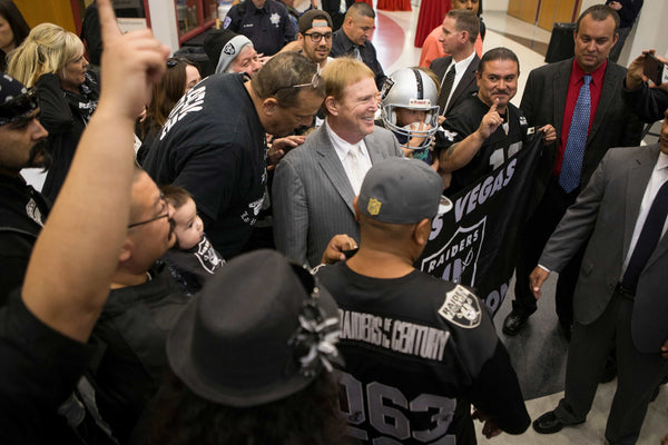 Raiders owner Mark Davis, center, poses with fans following a news conference on the proposed Las Vegas dome stadium at the Stan Fulton Building at UNLV on April 28, 2016. Erik Verduzco/Las Vegas Review-Journal