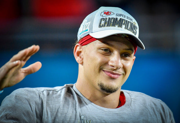 Mahomes donned championship attire for the Chiefs’ on-field victory celebration at Super Bowl LIV Feb. 2, 2020, inside Miami’s Hard Rock Stadium.  Kansas City Star / Tammy Ljungblad
