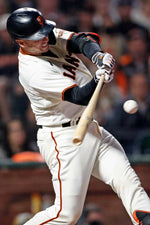 San Francisco Giants' Buster Posey hits a sacrifice fly in 3rd inning against Arizona Diamondbacks during MLB game at Oracle Park in San Francisco, on Sept. 30, 2021. Scott Strazzante / The Chronicle