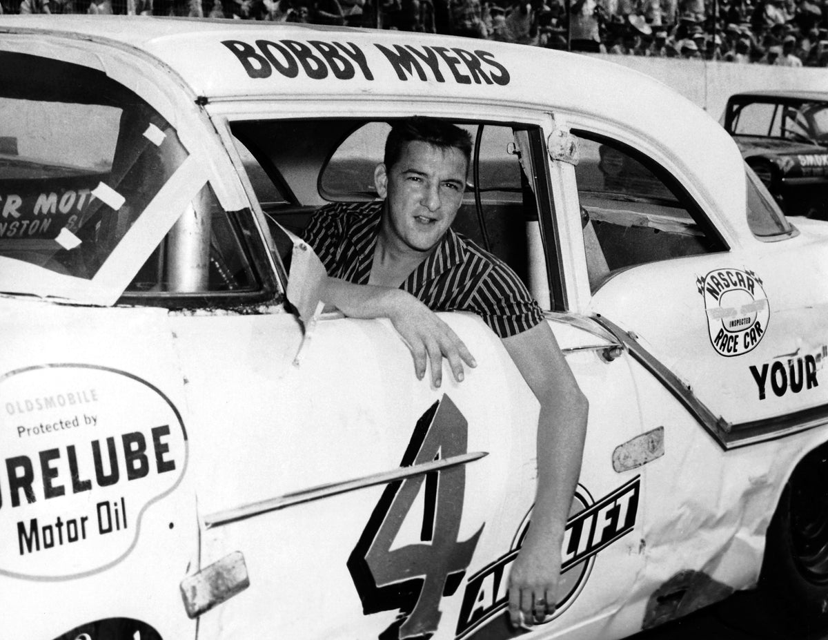 Bobby Myers poses with his Lee Petty-owned Oldsmobile before the 1957 Southern 500 at Darlington Raceway. Myers was killed in a wreck during the race. CourtesyISC Images & Archives via Getty Images