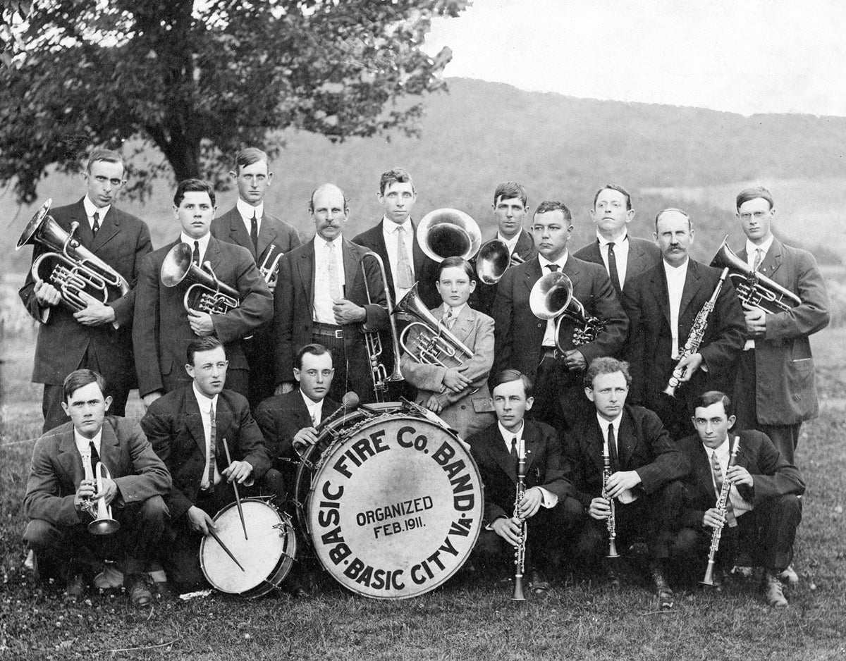 Basic Fire Company Band, Basic City, 1913. Formed in 1911 and sponsored by the fire company. Members include, front to left: Lee Gardner, Roy Heatwole, William Heatwole, John Rhodes, Doly Vines and Ben Craig. Back row, from left: Massie Meeks, Durward Frye, Carl Plesants, E.B. McGahey, E.S. Lassiter, Sam Heatwole, O.B. Newcome, V.I. Guyer, C.T. Cross, J.B. McGahey (organizer and director), and O.L. Cooke Sr. The group played at local lawn parties. Courtesy Waynesboro Public Library Collection