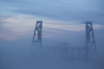 The Steel Bridge rises above the early morning fog. Beth Nakamura/The Oregonian/OregonLive