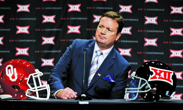Oklahoma head coach Bob Stoops listens to a reporter's question during the Big 12 Conference NCAA college football media days in Dallas, Tuesday, July 22, 2014. (AP Photo)