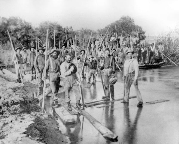 A group of lumber workers with tie hacks at the mouth of La Barge Creek near Green River, 1903. Wyoming State Archives