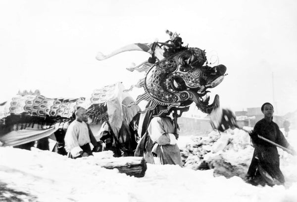 A dragon dance being performed in Rock Springs during a celebration in 1899. Wyoming State Archives