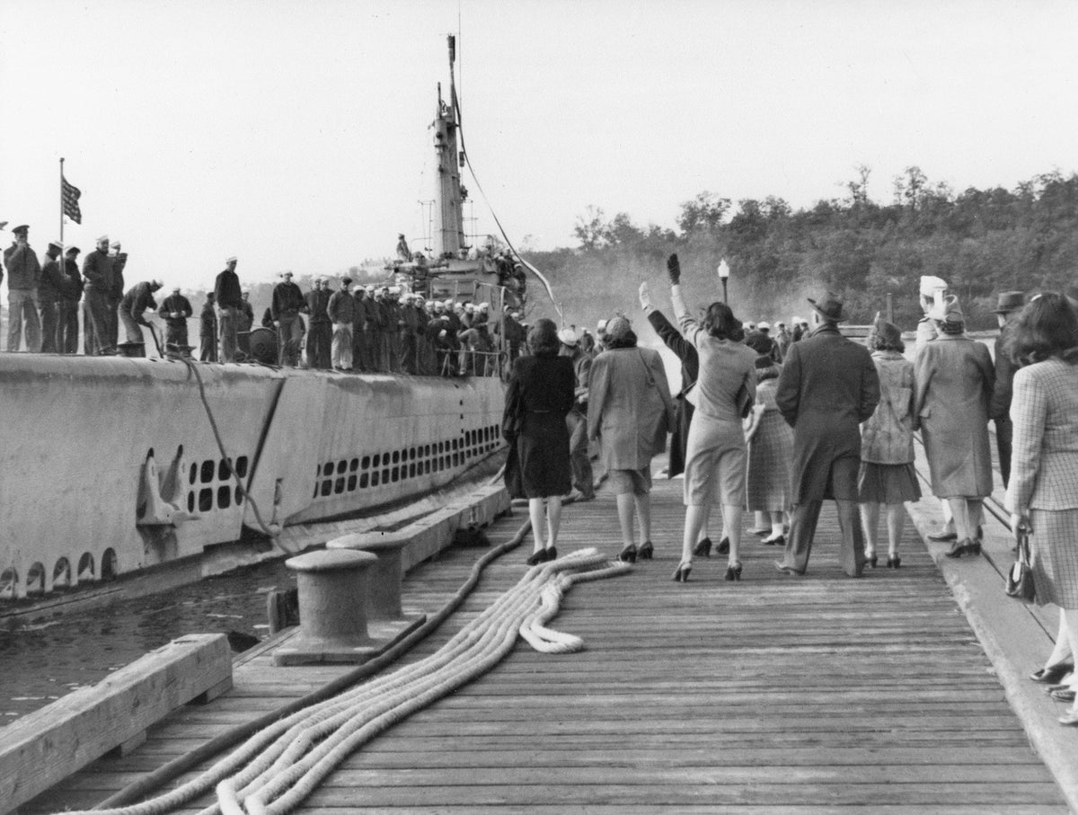 Loved ones greet USS Sea Poacher (SS-406) returning to the Subase following a Pacific war patrol. Courtesy Submarine Force Library and Museum