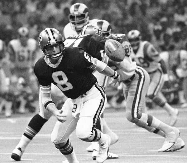 New Orleans Saints quarterback Archie Manning (8) eyes the football that has just popped from his grasp during a game against the Los Angeles Rams, Oct. 1, 1978. AP Photo