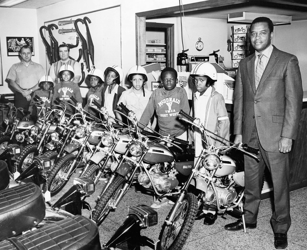 Boys from the William M. McDonald YMCA looking almost too excited to have their photo taken while on a visit to a local motorcycle shop in Fort Worth, circa 1972. Courtesy Tarrant County Black Historical and Genealogical Society, Fort Worth Public Library