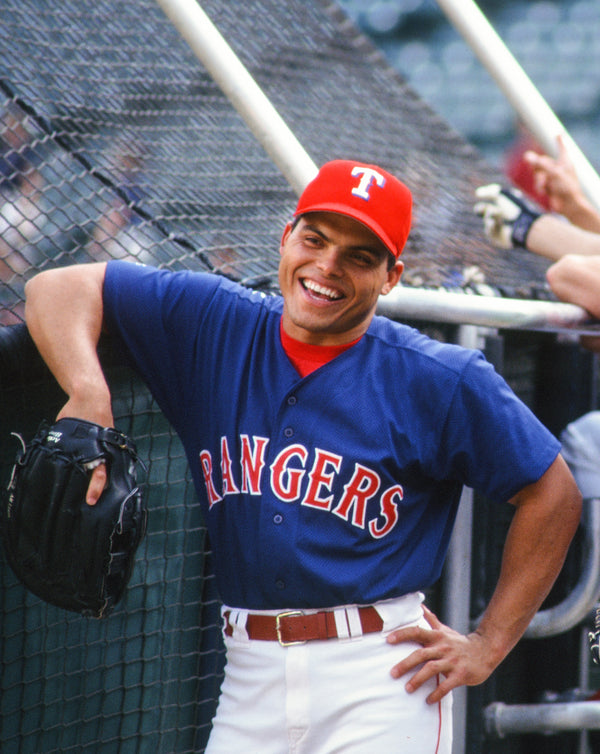 Color photograph of Texas Rangers players Ivan Rodriguez and Benji Gil, 1996.
