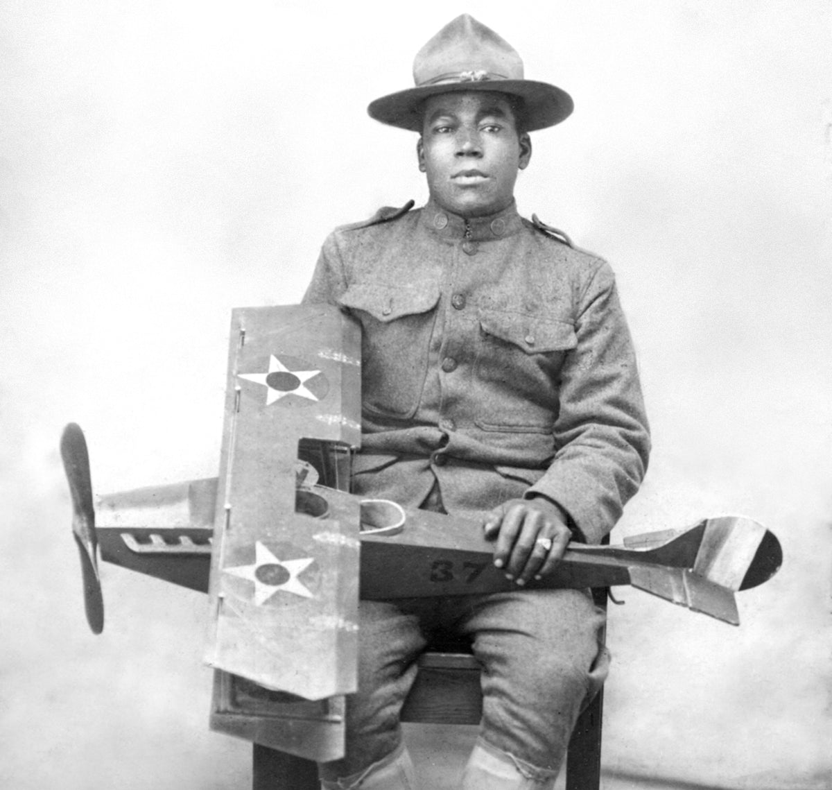 Culpeper native John Simon Ford, a World War I veteran and sergeant with the Army Air Service’s 37th Construction Company, holds a biplane model. He excelled at carpentry and commuted to Norfolk Shipyard, supporting his family’s educational dreams and returning home on weekends. He was the husband of Ruth Regina Robinson; they had three sons. Courtesy Ruth Renee Lewis