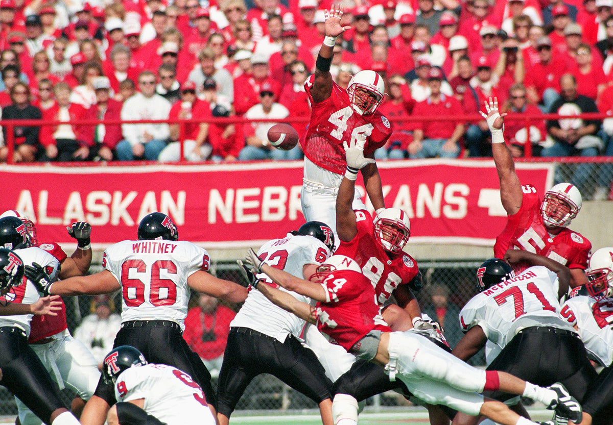 Jay Foreman (44) leaps above the Husker defensive line in an attempt to block Jaret Greaser’s 52-yard field-goal attempt. The kick missed and Texas Tech lost to NU 29-0. Courtesy Lincoln Journal Star