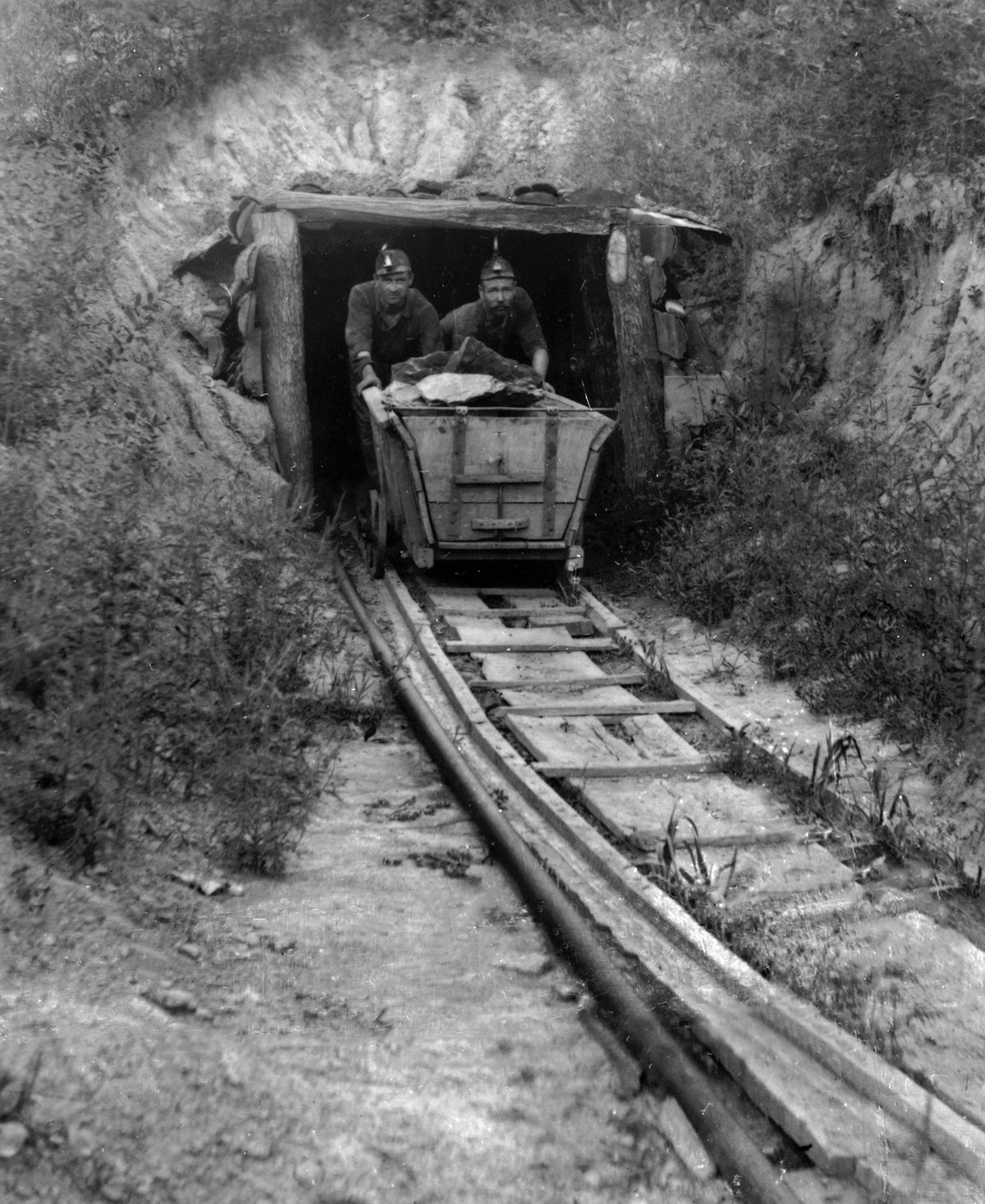 Coal miners exiting a coal mine at Port Washington with a cart filled with ore, circa 1915. Courtesy Tuscarawas County Historical Society