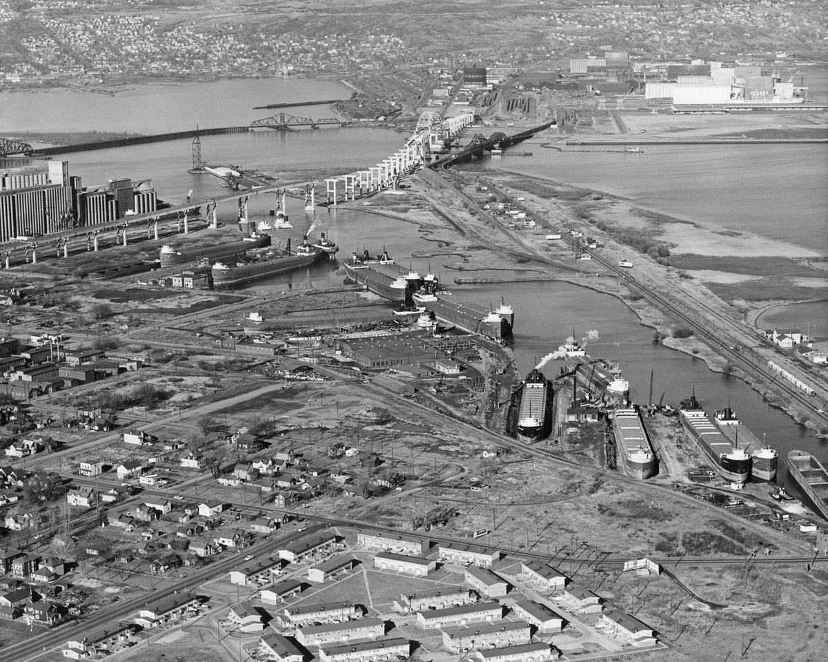 View of Superior including the Fraser-Nelson Shipbuilding & Dry Dock Company, at Third Street and Clough Avenue, circa 1960. Courtesy University of Wisconsin-Superior, Jim Dan Hill Library Archives - Lake Superior Maritime Collections ^^ center light rgba(40,40,35,0.5)
