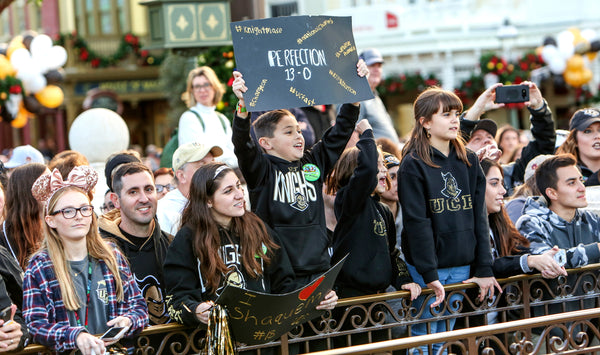 UCF fans line up along the parade route in the Magic Kingdom to cheer on the Knights during their celebration at Walt Disney World. Jacob Langston / Orlando Sentinel