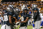 UCF running back Adrian Killins Jr. celebrates with his teammates in the end zone after a touchdown at Spectrum Stadium. Aileen Perilla / Orlando Sentinel