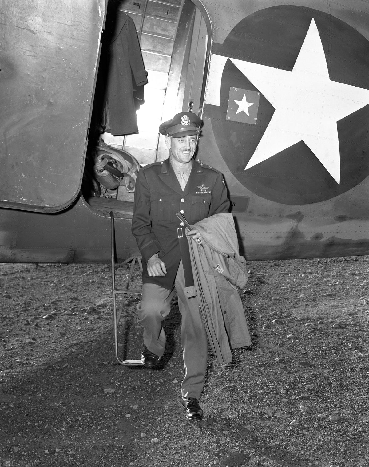 General Roger M. Ramey disembarking from a military plane in 1957. A 1921 grad of Denton High, Ramey entered the local National Guard unit while attending North Texas State Teachers College. By the time he retired from the military in 1957, he had risen to three-star status as a Lieutenant General. Courtesy University Photograph Collection (U0458), University of North Texas Special Collections / #UNTA_U0458-099-734-02
